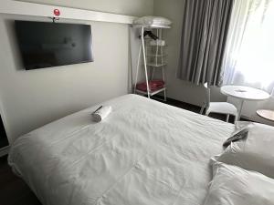 Postel nebo postele na pokoji v ubytování ibis Abbeville