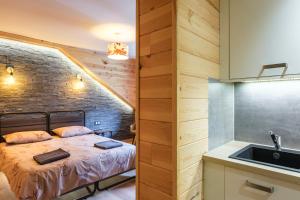 Postel nebo postele na pokoji v ubytování Apart Hôtel des Cols