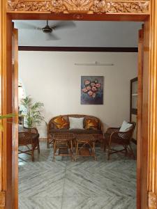 a living room with a table and chairs at Ashray Seaside in Jāmb