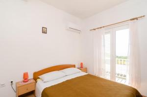 Posteľ alebo postele v izbe v ubytovaní Apartments Felix