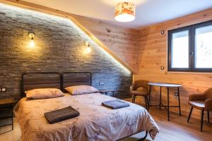 Postel nebo postele na pokoji v ubytování Apart Hôtel des Cols