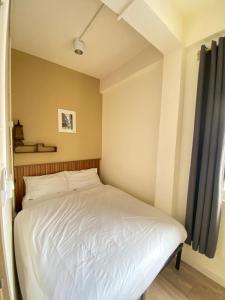 Bangkok Neighborhood Hostel客房内的一张或多张床位