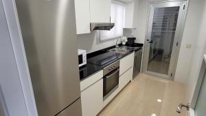 Kuchyň nebo kuchyňský kout v ubytování Miramar apartamentos Cosmos