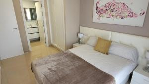 Postel nebo postele na pokoji v ubytování Miramar apartamentos Cosmos