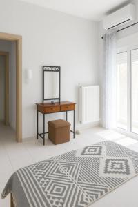 a bedroom with a bed and a desk and a mirror at Lion house Vrachati in Vrachati