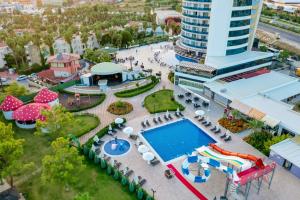 an overhead view of a pool at a resort at The Marilis Hill Resort Hotel & Spa Ultra All Inclusive in Okurcalar +44 photos