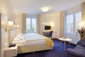 Postel nebo postele na pokoji v ubytování Hotel Inselfriede