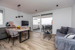 a living room with a couch and a table at Apartman Luna in Trogir