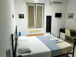 Postel nebo postele na pokoji v ubytování B&B Oasi al Mare