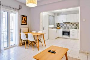 a kitchen and dining room with a table and chairs at Lion house Vrachati in Vrachati