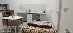 a kitchen with a table and a bed in a room at Casa El Drago-TAFIRA BAJA in Las Palmas de Gran Canaria +85 photos