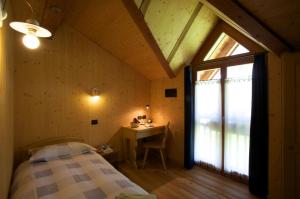 Postel nebo postele na pokoji v ubytování B&B Affittacamere Larix
