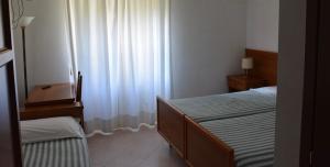 Postel nebo postele na pokoji v ubytování Albergo Miravalle