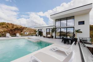 a villa with a swimming pool and a house at Villa 30 Luxury Place Vlore in Fshati i Ri