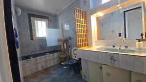 a bathroom with a sink and a toilet at Beautiful Family House near Paris in Villeneuve-Saint-Georges +12 photos