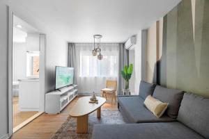 Uma TV ou centro de entretenimento em Hotel Laurence