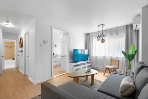 Uma TV ou centro de entretenimento em Hotel Laurence