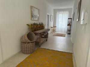 a living room with a bench and a rug at Locanda Francini in Badia A Passignano
