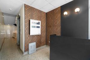 Uma TV ou centro de entretenimento em Hotel Laurence