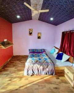 a bedroom with a bed and a ceiling at sukhwan BY WILD FLOWER in Mulshi