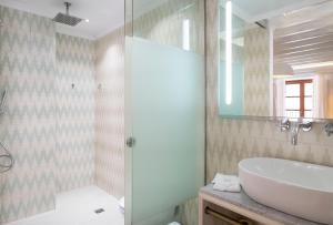a bathroom with a sink and a shower at Son Sant Jordi in Pollença