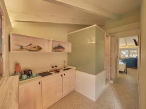 a kitchen with a counter and a sink in a room at Son Sant Jordi in Pollença