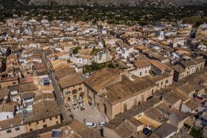 an aerial view of a city with buildings at Son Sant Jordi in Pollença