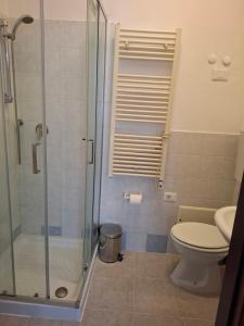 a bathroom with a toilet and a glass shower at Lucazione Turistica in Mestre +50 photos