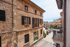 a view of an alley from a building at Son Sant Jordi in Pollença