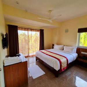 Postel nebo postele na pokoji v ubytování Hotel Jubilant