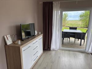 TV a/nebo společenská místnost v ubytování Augustenhof Ferien