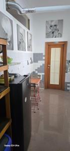 a kitchen with a counter and a table in a room at Bed and breakfast Nonna Lucia in Termoli