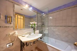 a bathroom with a sink and a shower at Casa Son Sant Jordi in Pollença