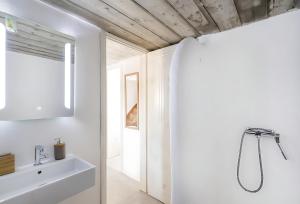 a bathroom with a sink and a mirror at Ocean view villa in Mikonos +18 photos