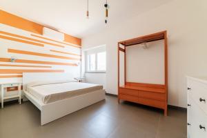 Ένα ή περισσότερα κρεβάτια σε δωμάτιο στο Casa Il Paino