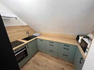 A kitchen or kitchenette at Talabér Vendégház