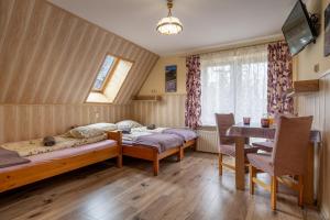 Posteľ alebo postele v izbe v ubytovaní Pokoje gościnne Tessa