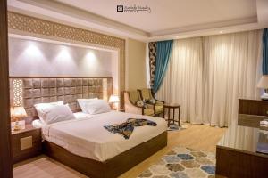 Ein Bett oder Betten in einem Zimmer der Unterkunft Nile Transportation hotel