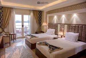 Ein Bett oder Betten in einem Zimmer der Unterkunft Nile Transportation hotel