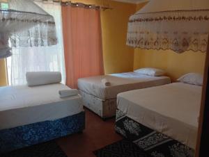 Letto o letti in una camera di Capricorn by Quest-Cape Maclear