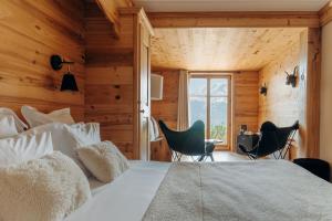 Postel nebo postele na pokoji v ubytování Le Chalet Hôtel Cordon Adults Only