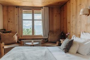 Postel nebo postele na pokoji v ubytování Le Chalet Hôtel Cordon Adults Only
