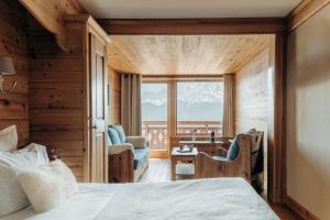 Postel nebo postele na pokoji v ubytování Le Chalet Hôtel Cordon Adults Only