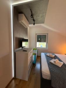 Postel nebo postele na pokoji v ubytování Apartment Zidaric