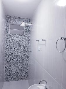 a bathroom with a shower with a toilet and a sink at Espaço IN 4 Quarto Brooklin in Sao Paulo