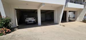 a car is parked inside of a garage at Bahr DELUX App & Suite in Ulcinj