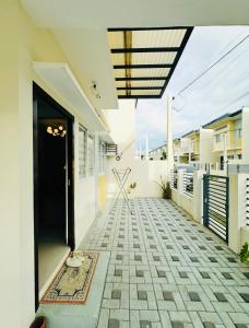 an empty hallway of a house with a door at Diamond Heights Azalea Davao in Davao City