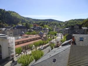 an aerial view of a town with a train at Le Richelieu "Côté sud" Appartement 302 in La Bourboule