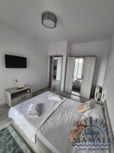 En eller flere senge i et værelse på Bliss 2 By SUNNY MAMAIA