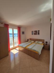 Postel nebo postele na pokoji v ubytování Apartmani Mira